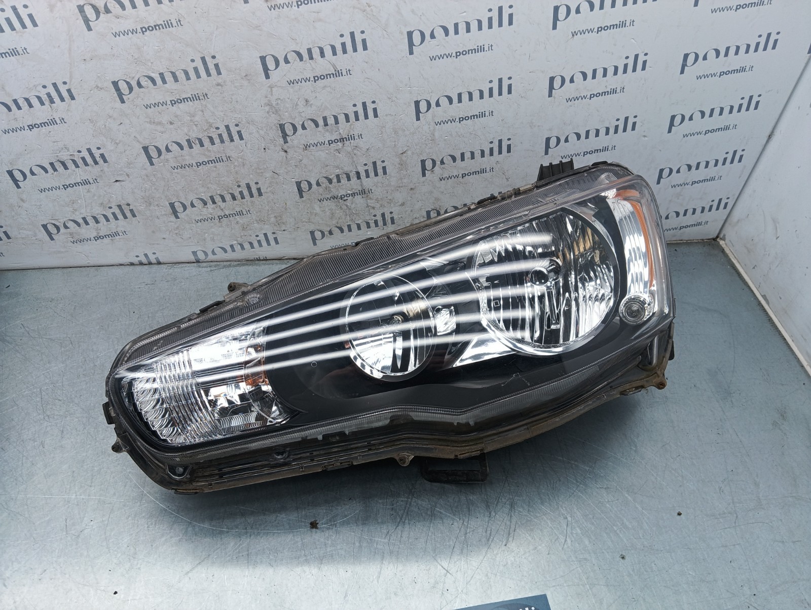 Pomili Fanaleria Lancer X faro anteriore sinistro EBM921-03 usato